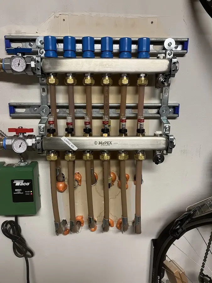 Plumber performing Water Heater Repair at a residential property in Oneida